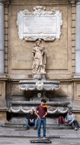 street violinist performing in front of Quattro Canti Palermo